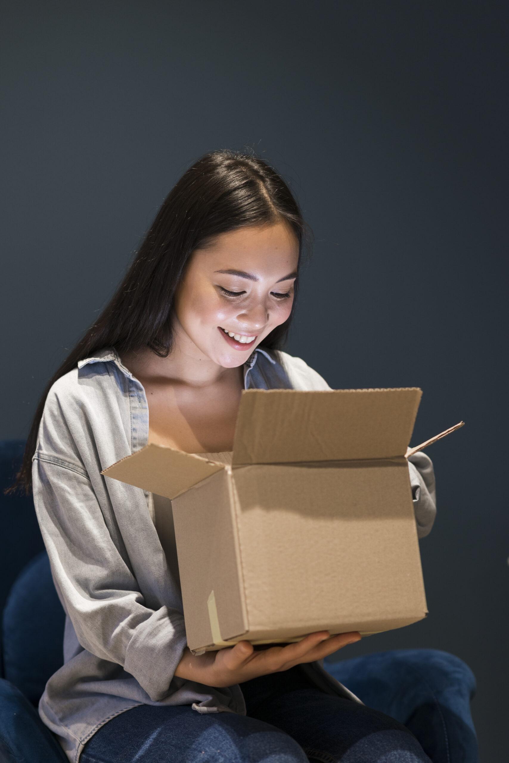 woman-looking-box-after-ordering-online