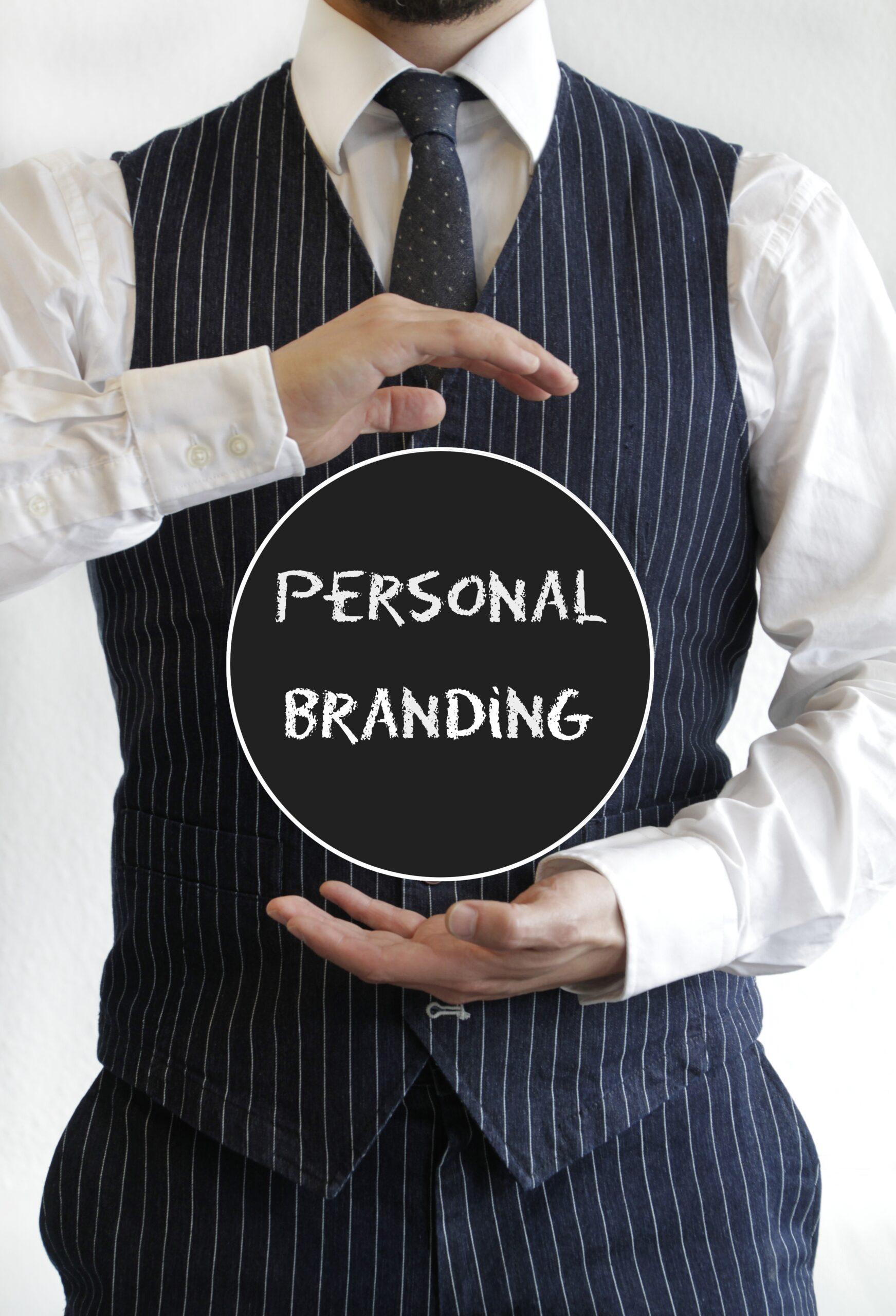 Man with a personal branding text on a black circle in the middle of his hands